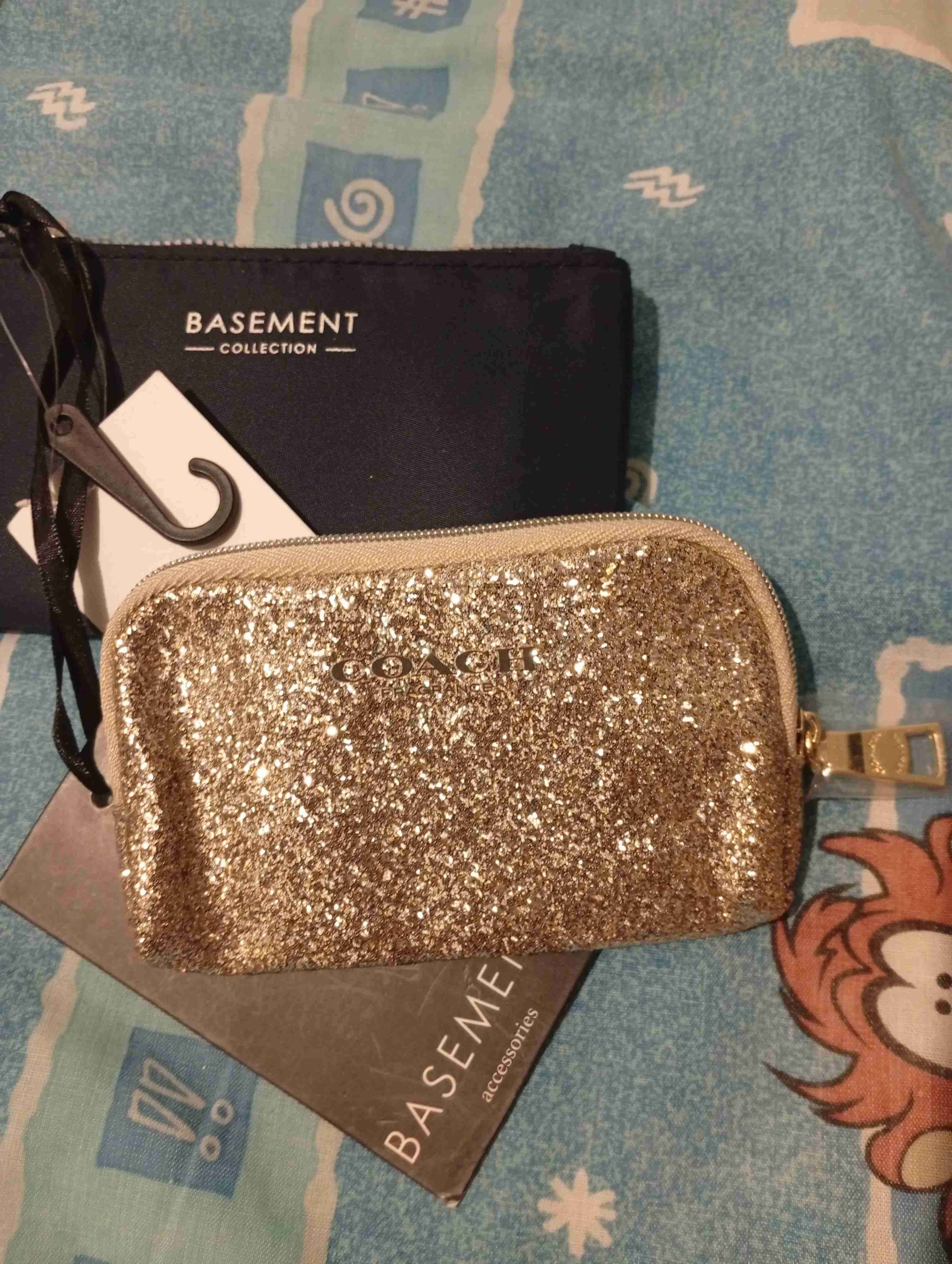 Monedero dorado brillante Coach