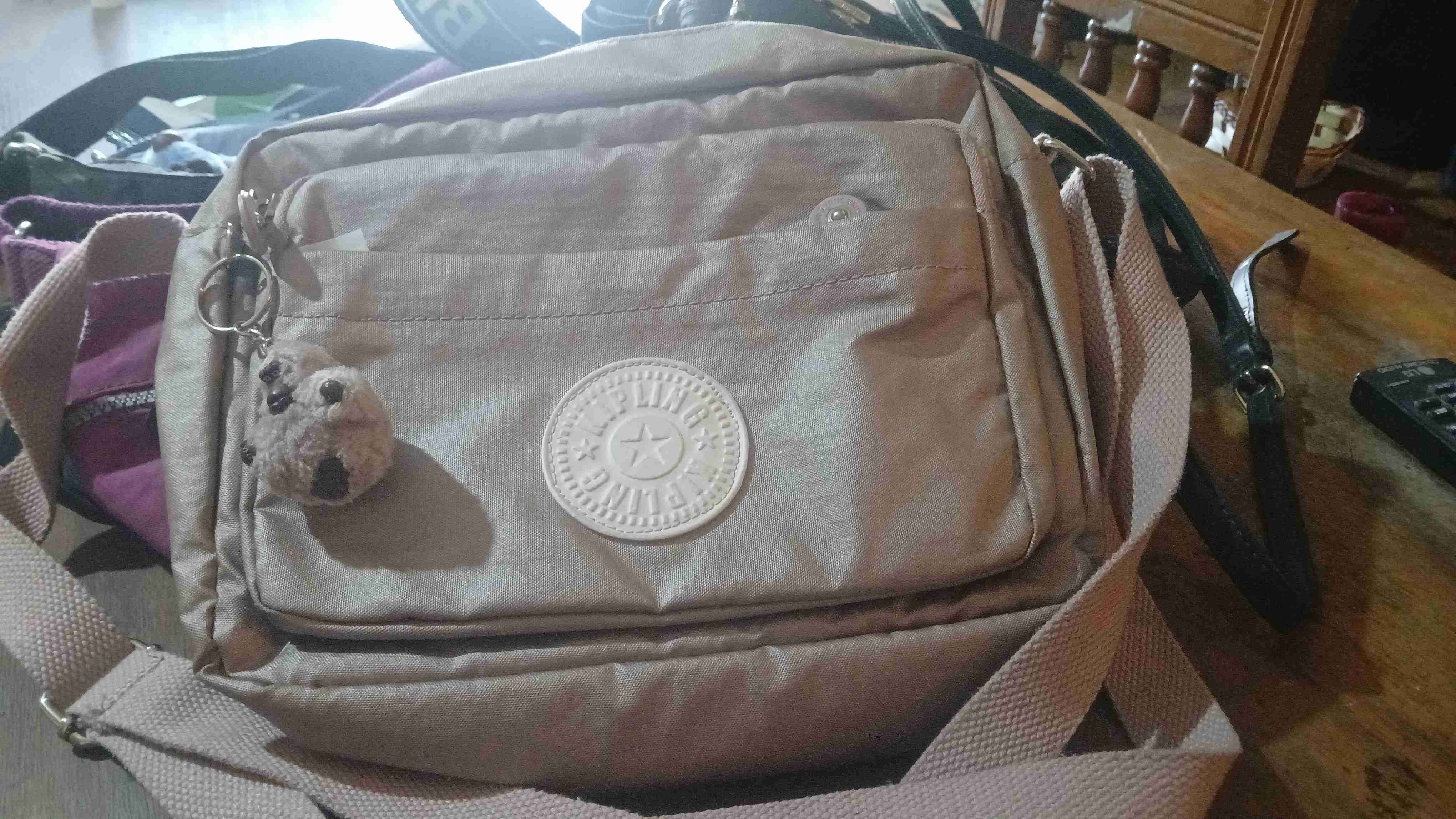 Mochila kipling beige con llavero
