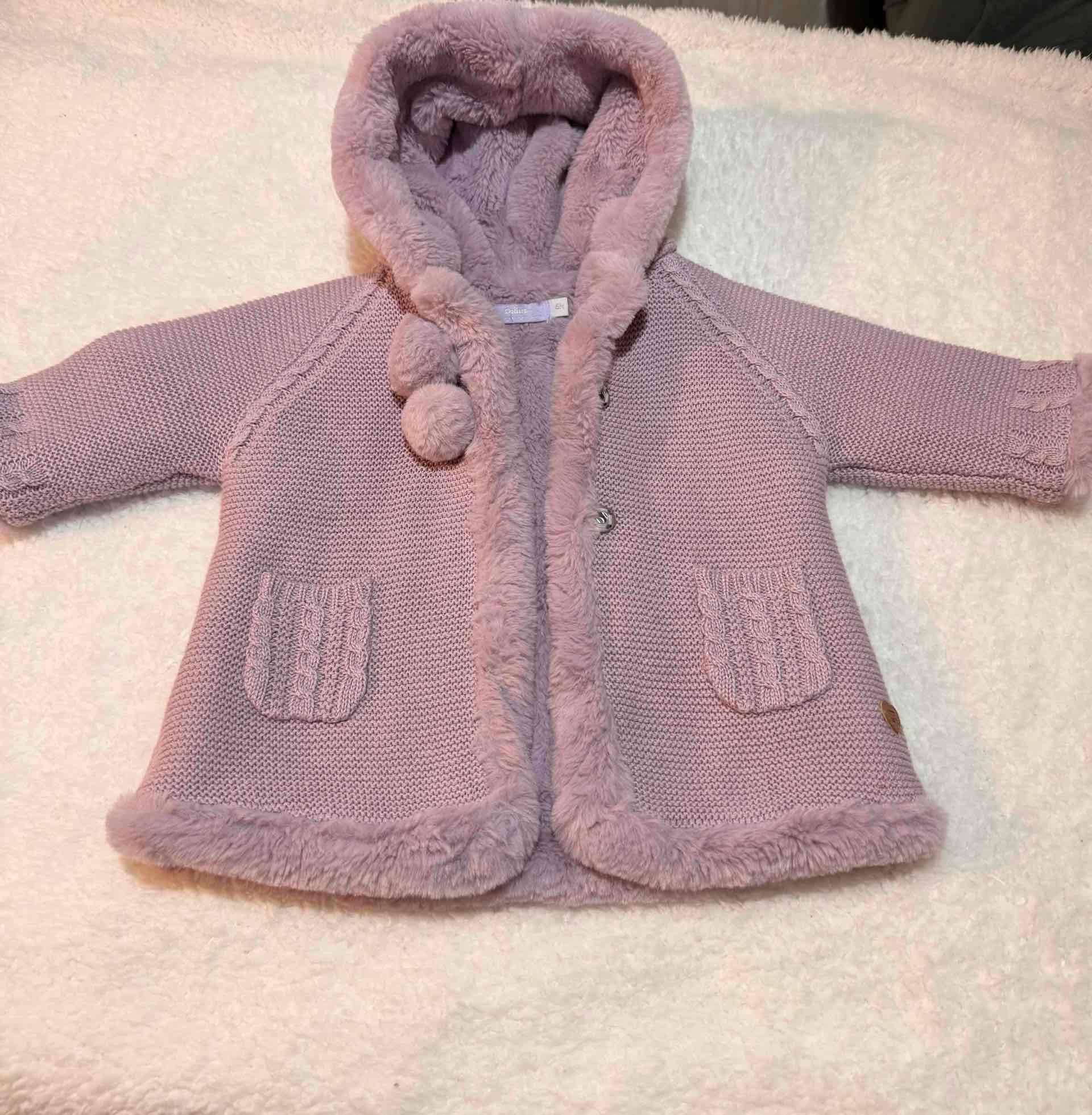 Abrigo rosado para bebé con capucha