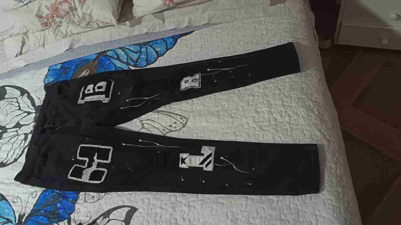 Pantalones negros con estampado - miniatura 1