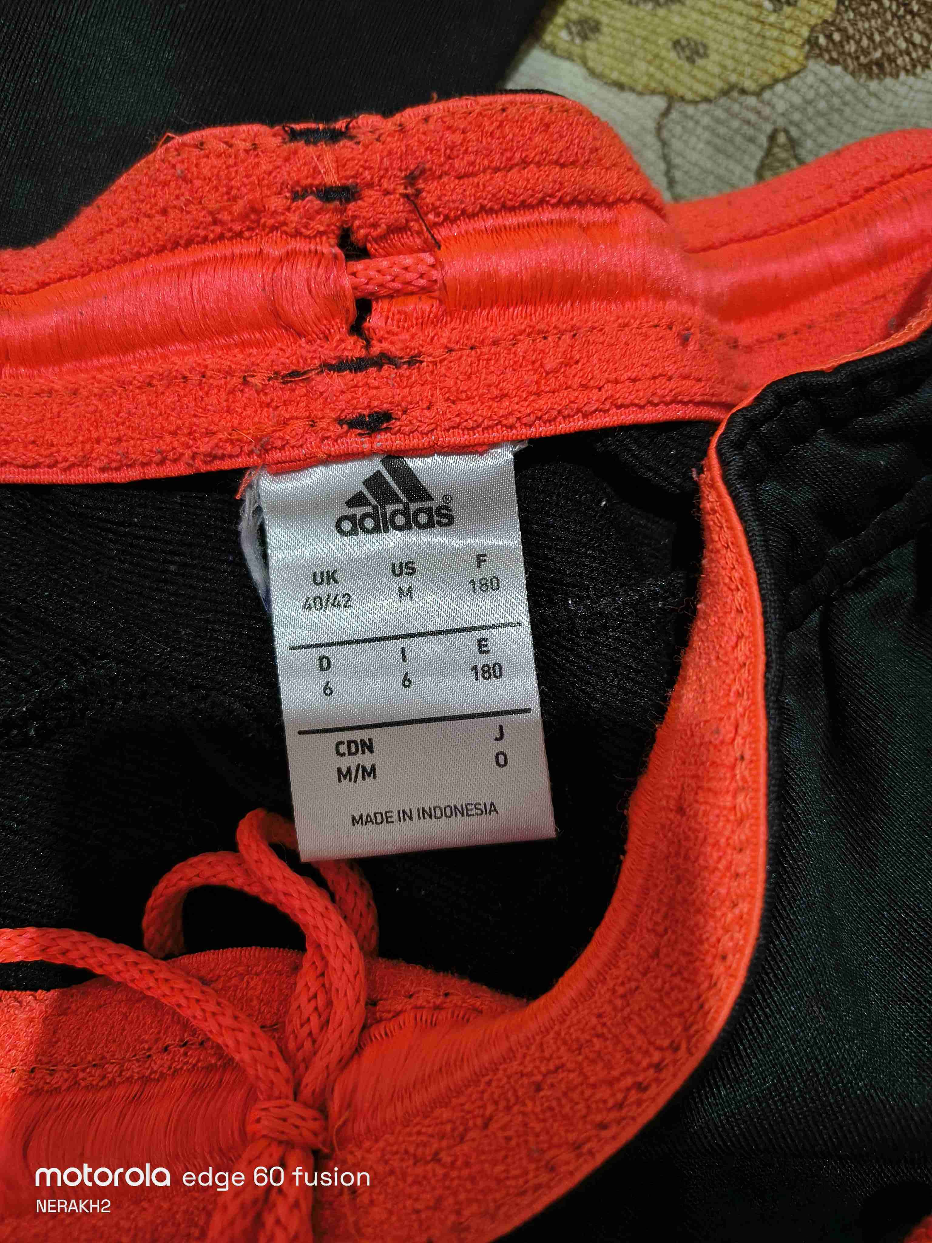 Conjunto deportivo negro y naranjo original - miniatura 6