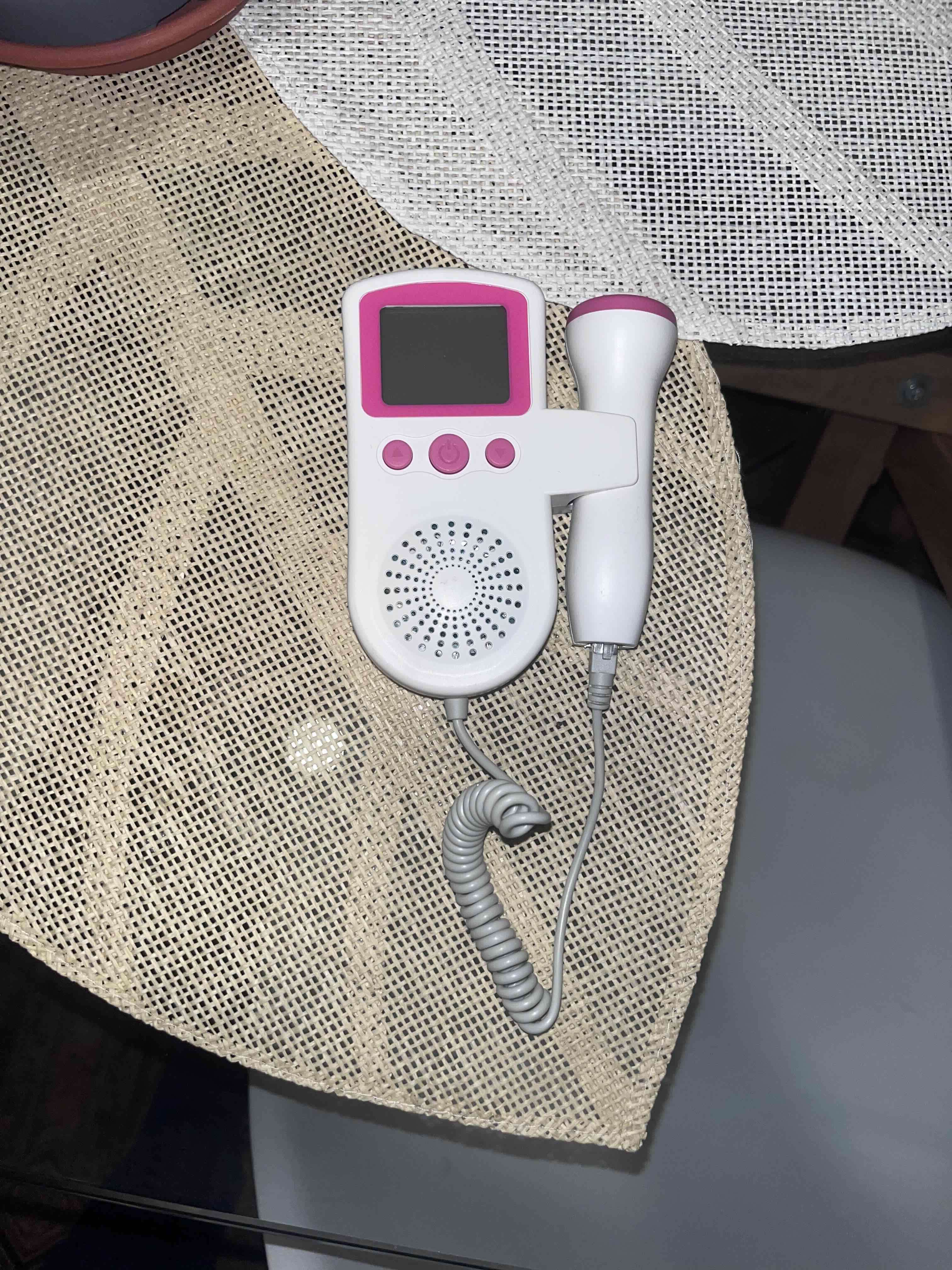 Doppler fetal portátil blanco y rosado