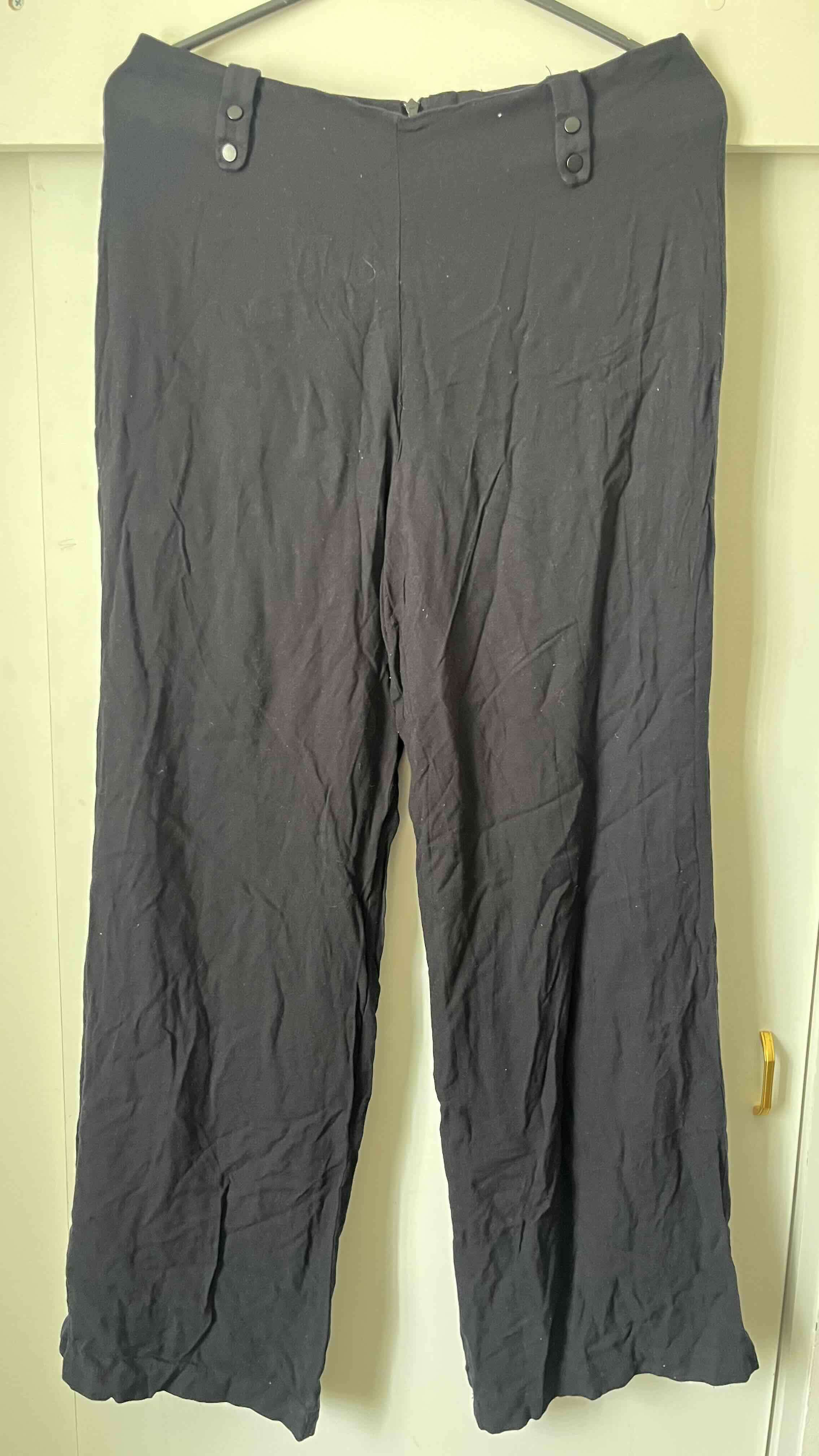 Pantalones negros clásicos - miniatura 1