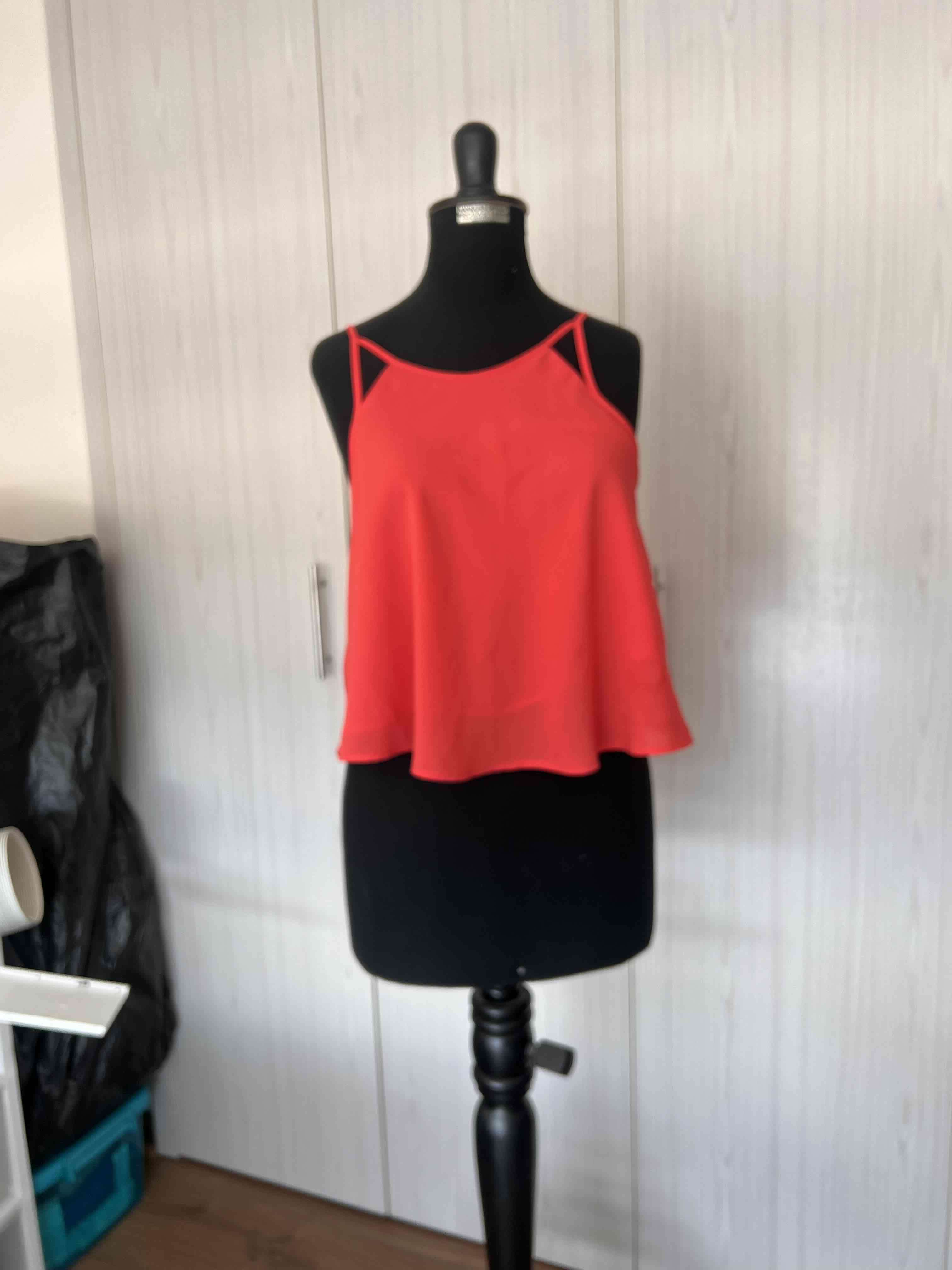 Top naranja de tirantes