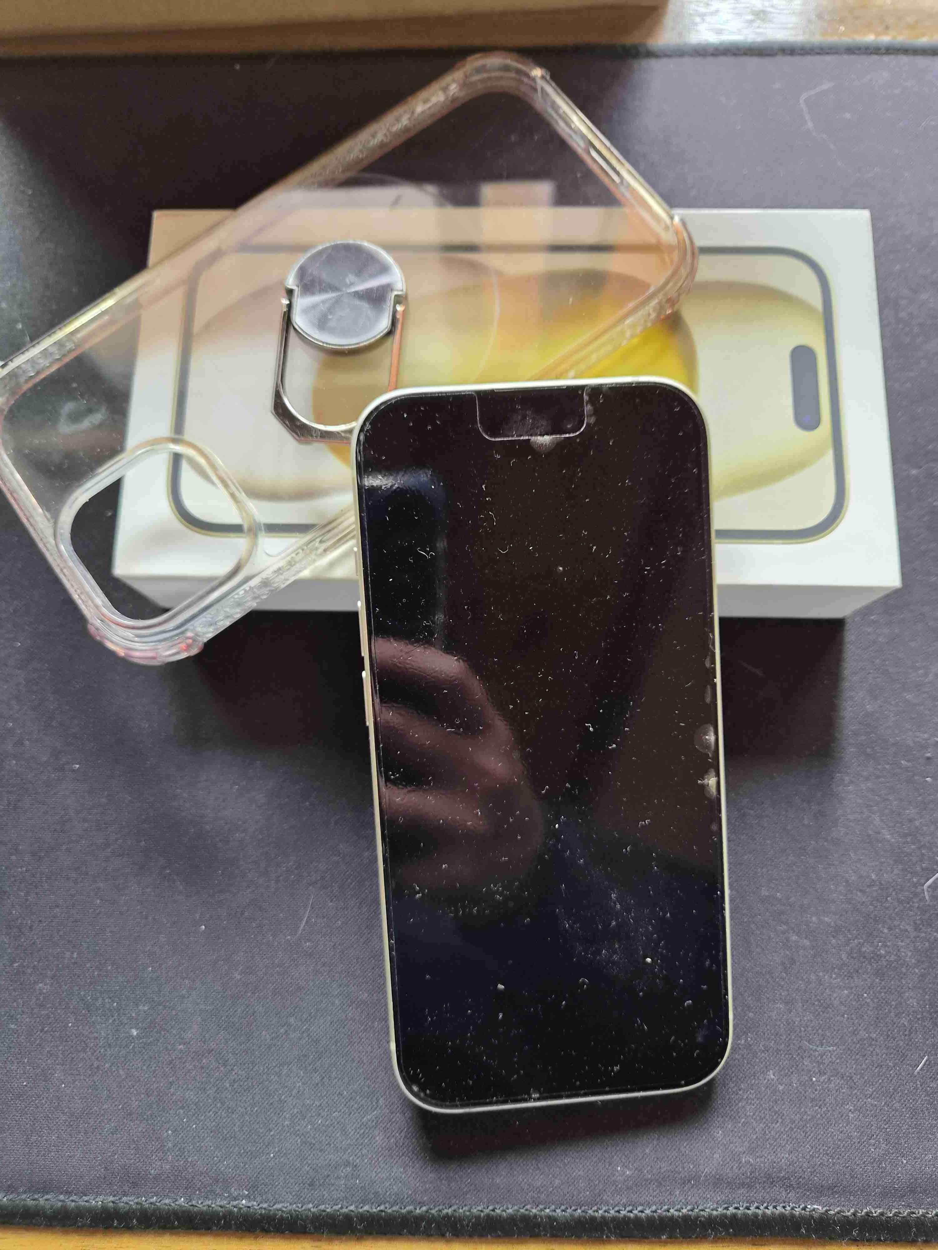 Smartphone con funda y caja - miniatura 1