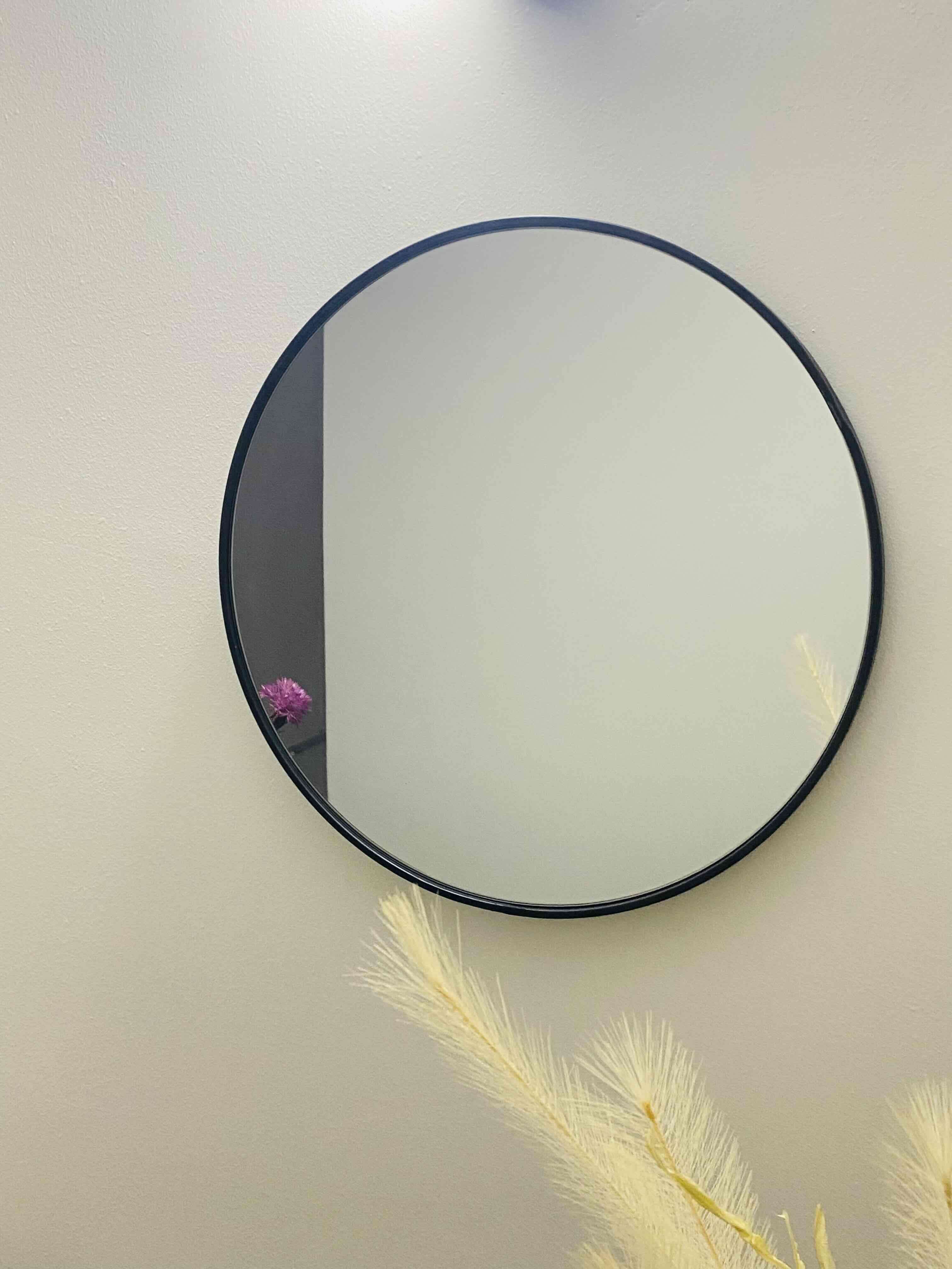 Espejo redondo con marco negro
