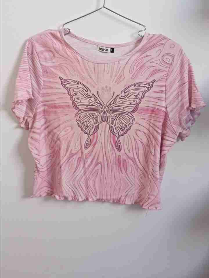 Polera rosa con mariposa - miniatura 1