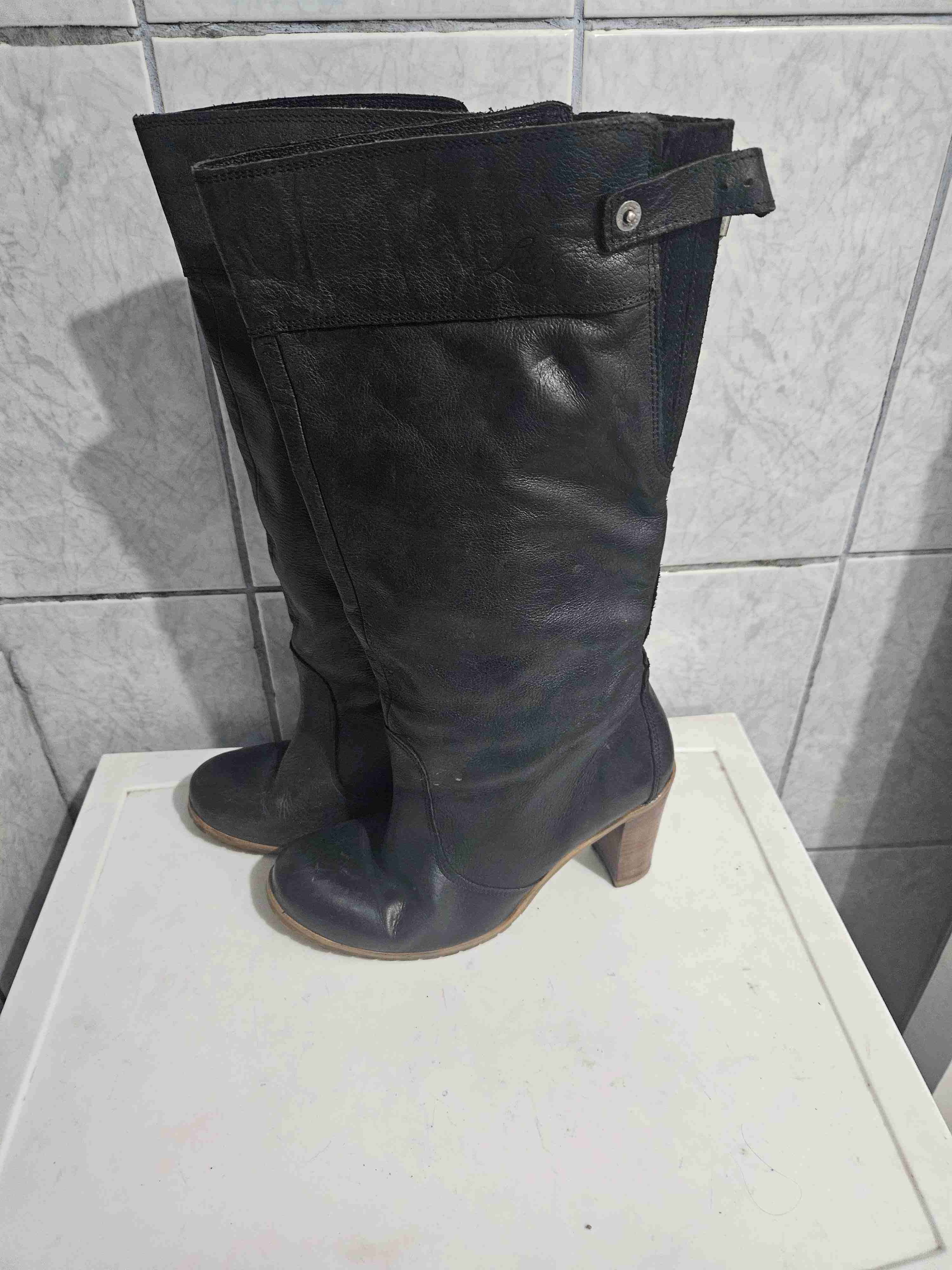 Botas altas negras de cuero - miniatura 1