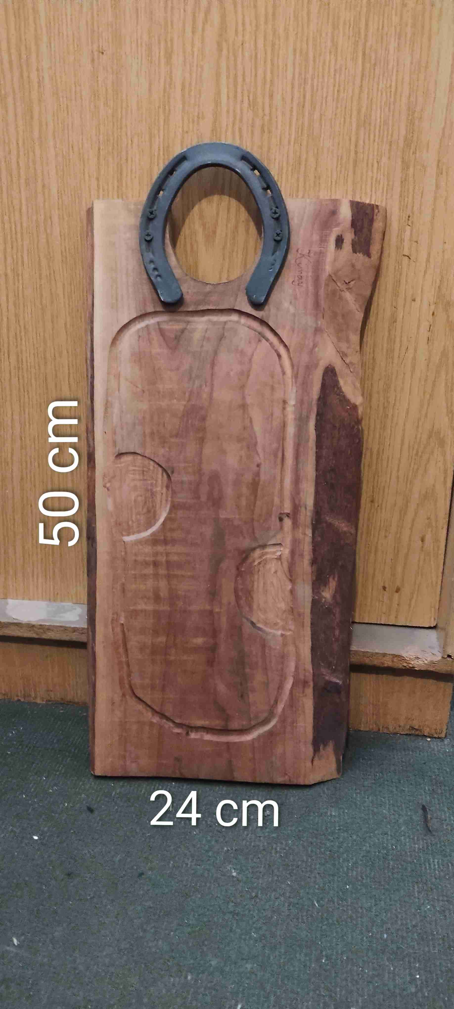 Tabla de madera con herradura