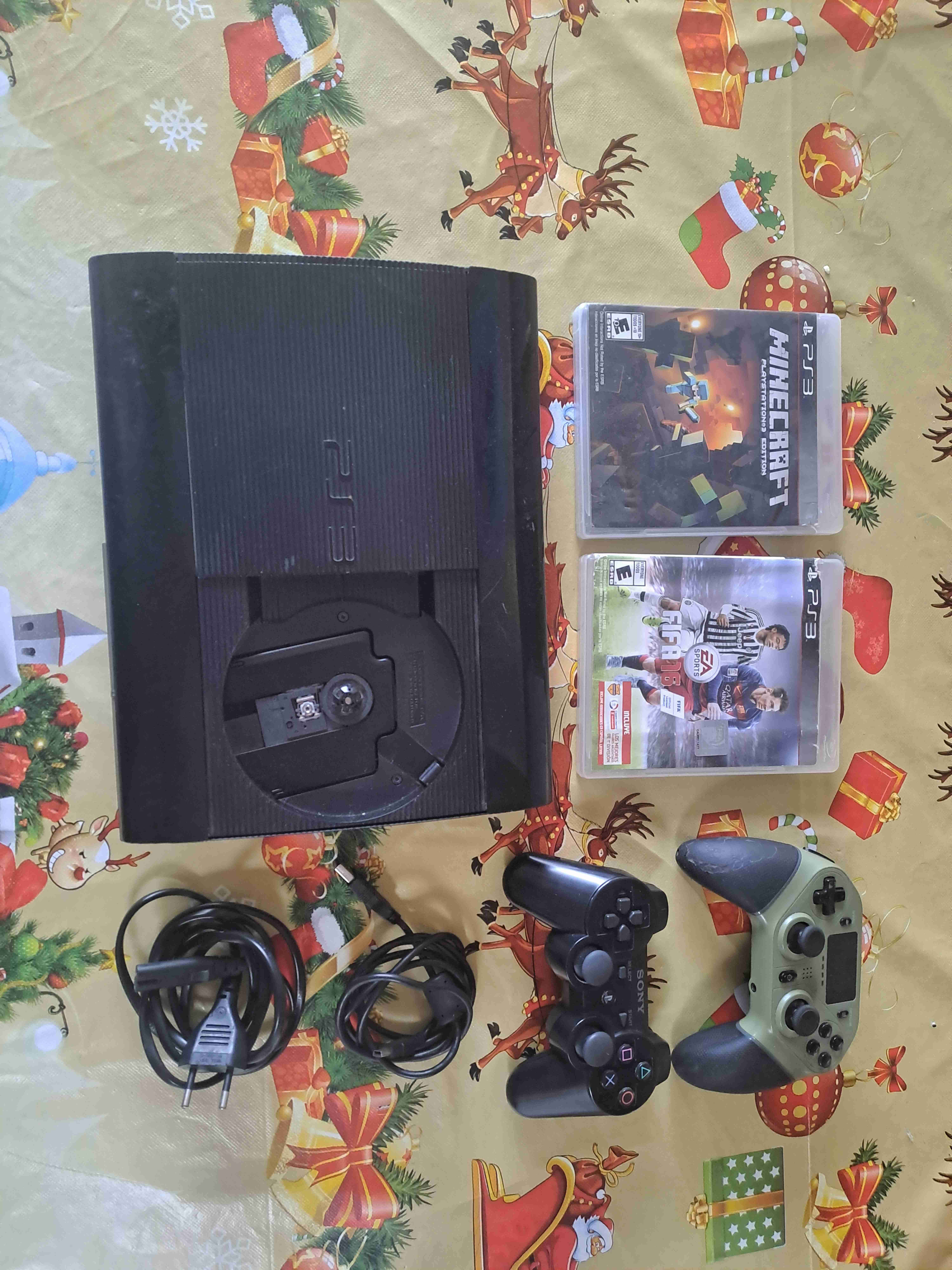 Consola PS3 con juegos y controles - miniatura 1