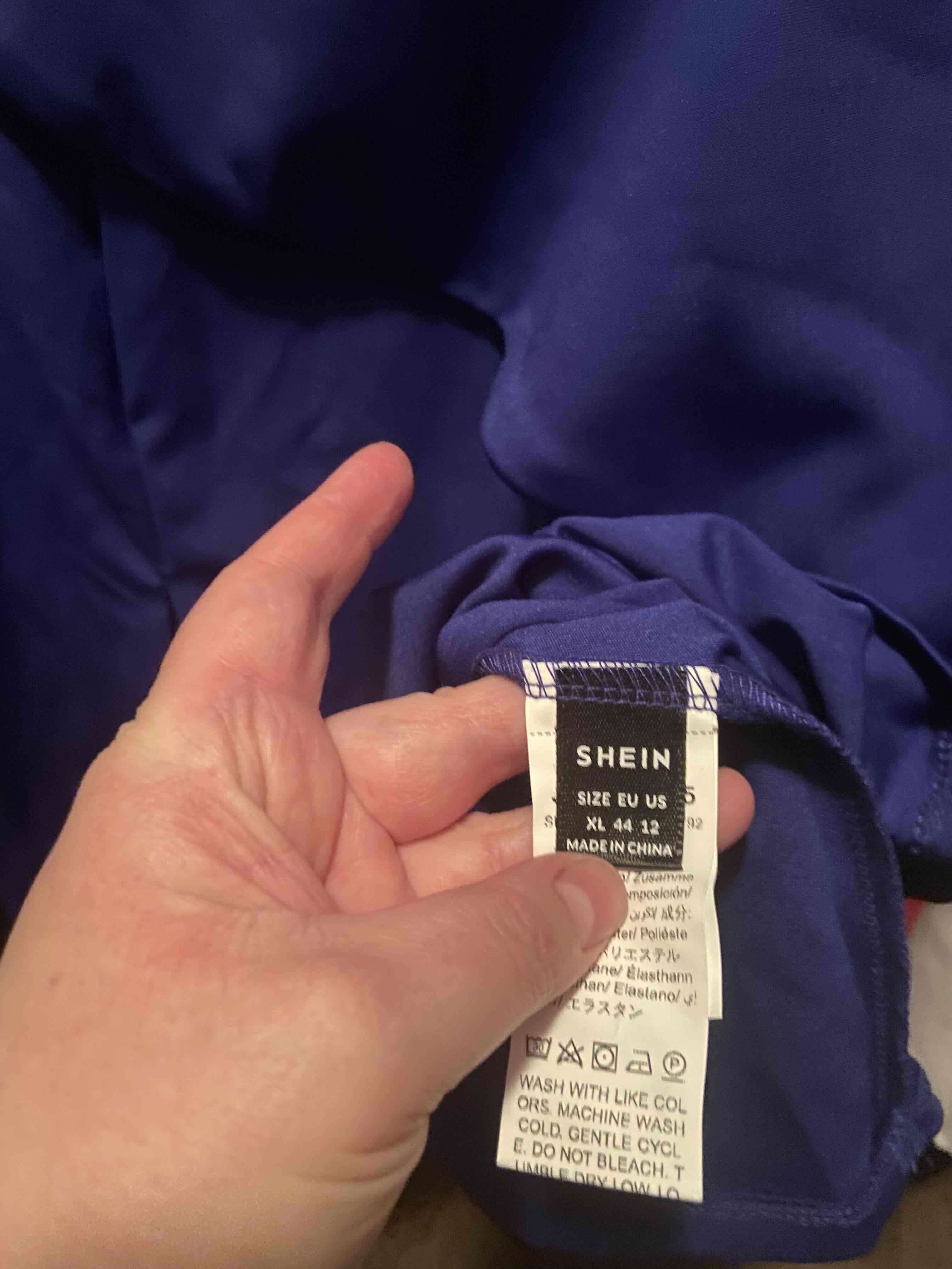 Blusa azul peplum con cuello asimétrico - miniatura 5