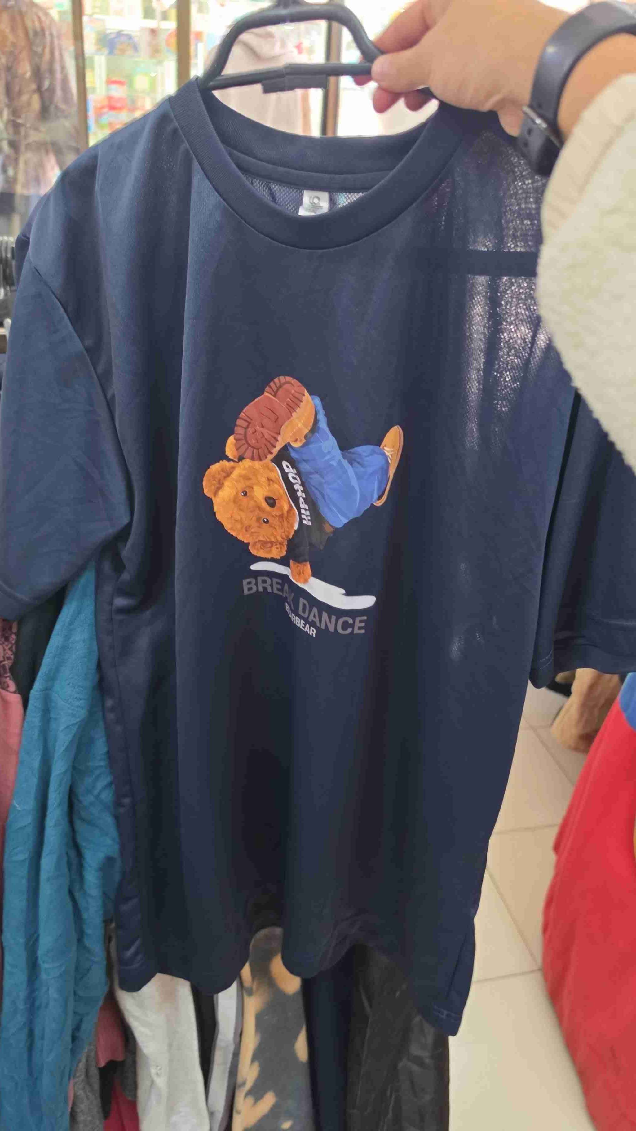 Polera blanca con diseño de sol - miniatura 2